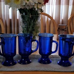 4 clear blue glass mugs